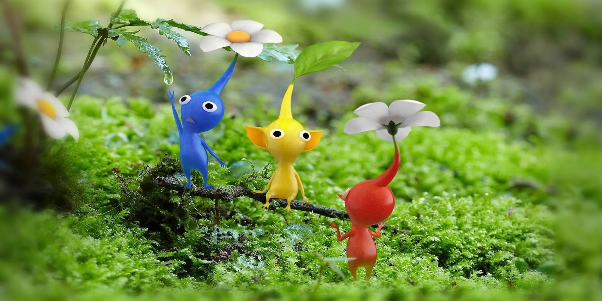 Các loại Pikmin màu xanh, vàng, đỏ ngồi trên cành cây trong Pikmin 3 Deluxe