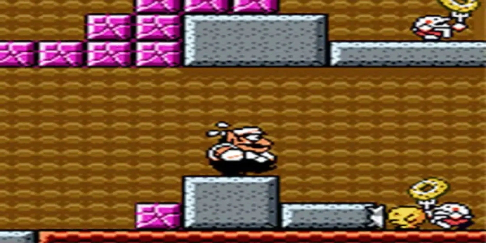 Wario trong một màn chơi giải đố của Wario Land 3 trên Game Boy Color