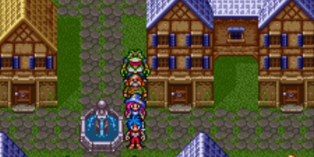 Một hàng nhân vật đứng gần đài phun nước trong game Breath of Fire 2