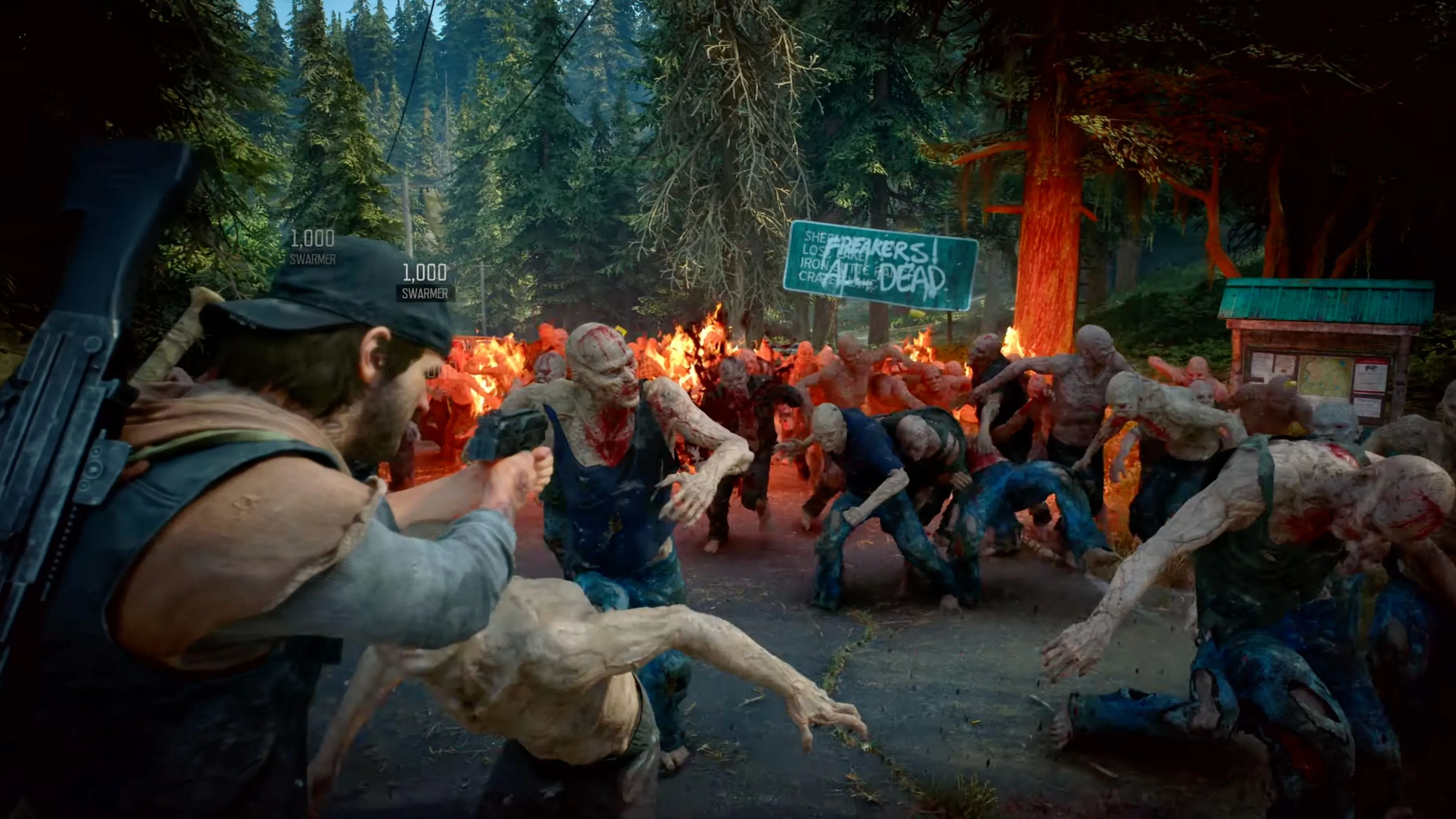 Phân cảnh hành động trong Days Gone Remastered, cho thấy Deacone St. John đối mặt với bầy Freakers giữa khung cảnh rừng cây rậm rạp.