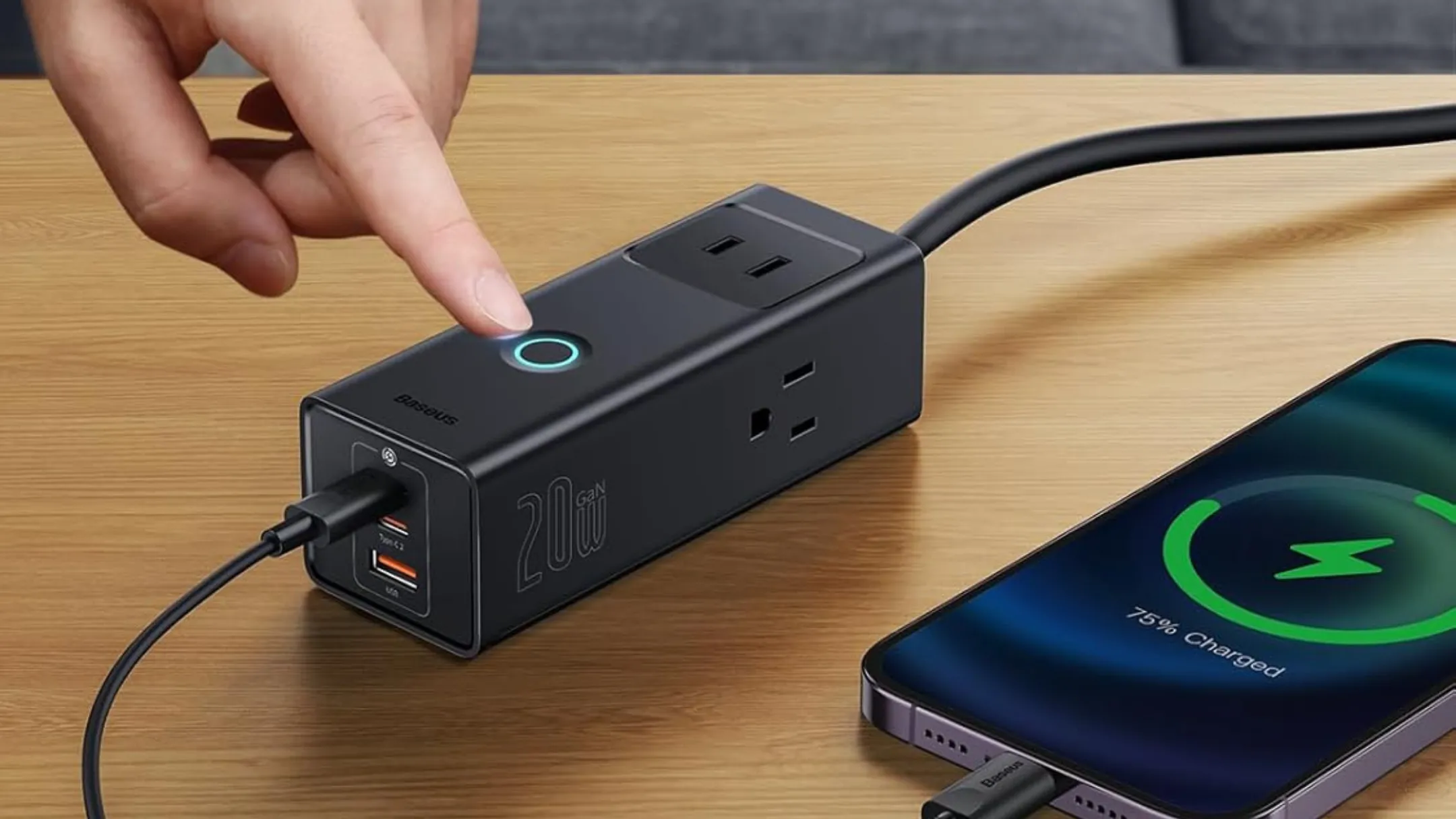 Baseus Power Strip 1200J đang sạc điện thoại qua cổng USB